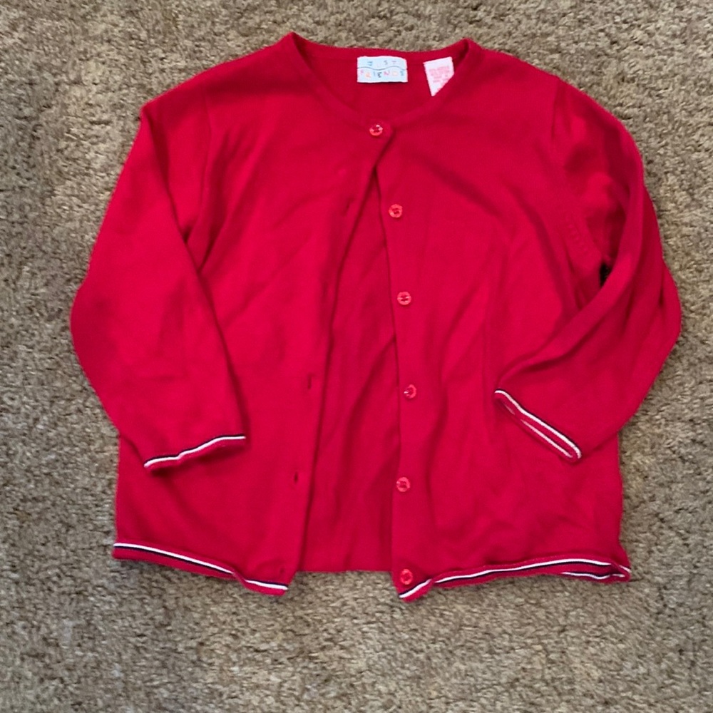 Girl’s red sweater